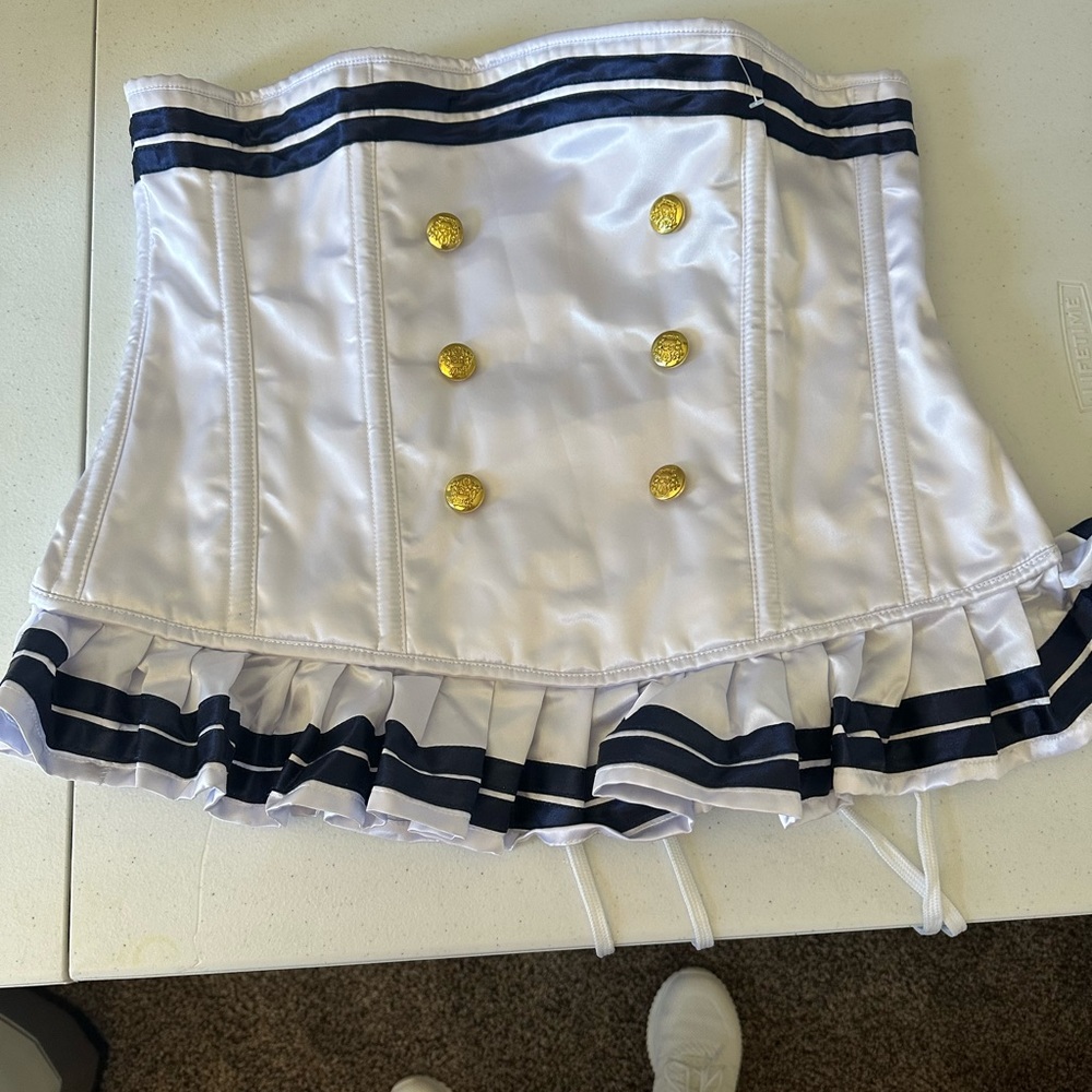 White corset with lace up back.